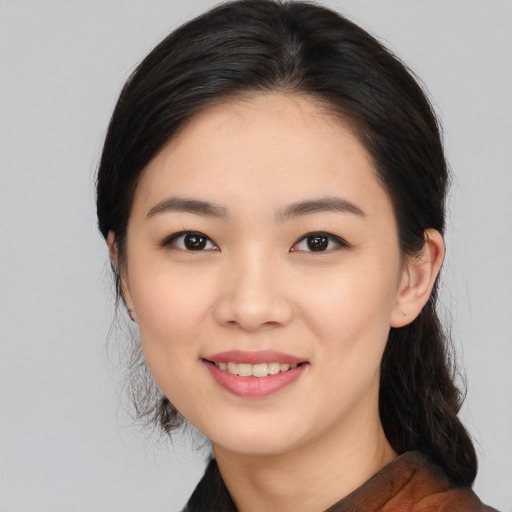 Joyful white young-adult female with medium  black hair and brown eyes