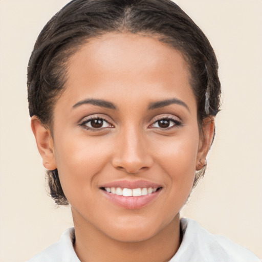 Joyful white young-adult female with medium  brown hair and brown eyes