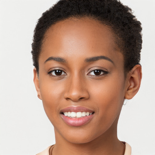 Joyful black young-adult female with short  brown hair and brown eyes