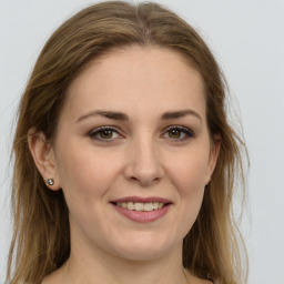 Joyful white young-adult female with long  brown hair and green eyes