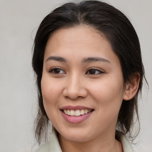 Joyful white young-adult female with medium  brown hair and brown eyes