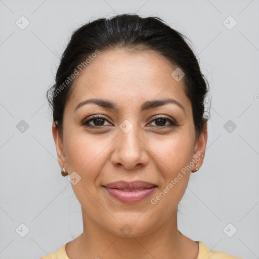 Joyful latino young-adult female with short  brown hair and brown eyes