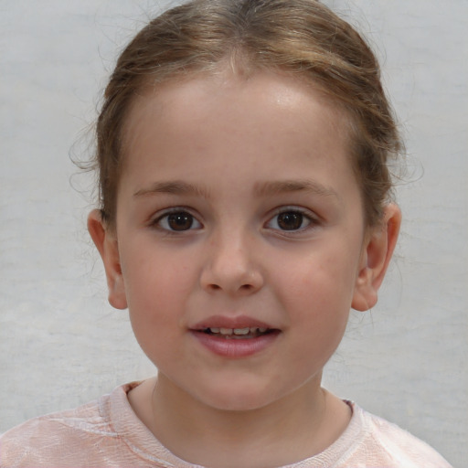 Joyful white child female with short  brown hair and brown eyes