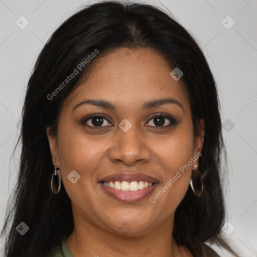 Joyful black young-adult female with long  brown hair and brown eyes