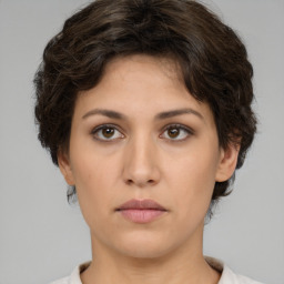 Neutral white young-adult female with short  brown hair and brown eyes