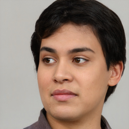 Joyful asian young-adult male with medium  black hair and brown eyes