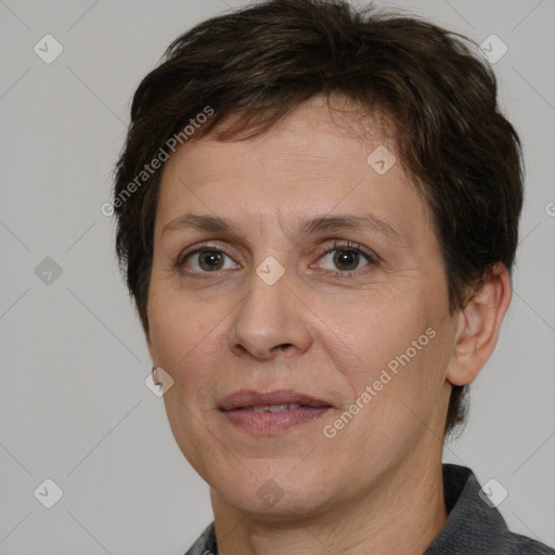 Joyful white adult female with short  brown hair and brown eyes