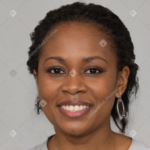 Joyful black young-adult female with medium  black hair and brown eyes