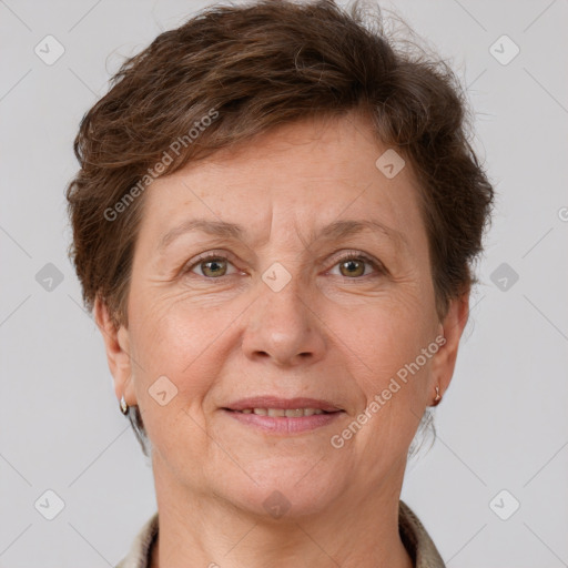 Joyful white adult female with short  brown hair and grey eyes