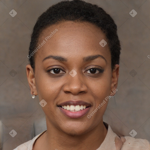 Joyful black young-adult female with short  brown hair and brown eyes