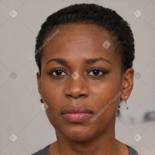 Neutral black young-adult female with short  brown hair and brown eyes