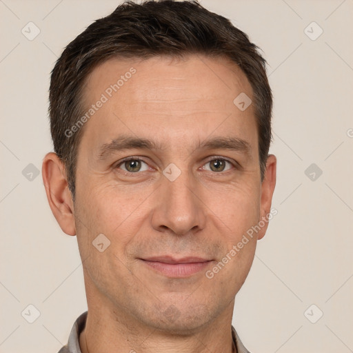 Joyful white adult male with short  brown hair and brown eyes