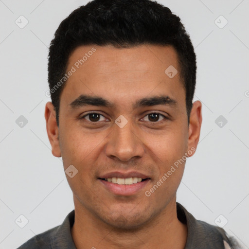 Joyful latino young-adult male with short  black hair and brown eyes