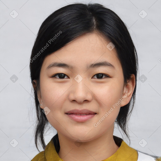 Joyful asian young-adult female with medium  black hair and brown eyes