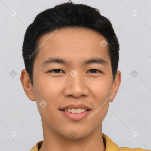 Joyful asian young-adult male with short  black hair and brown eyes