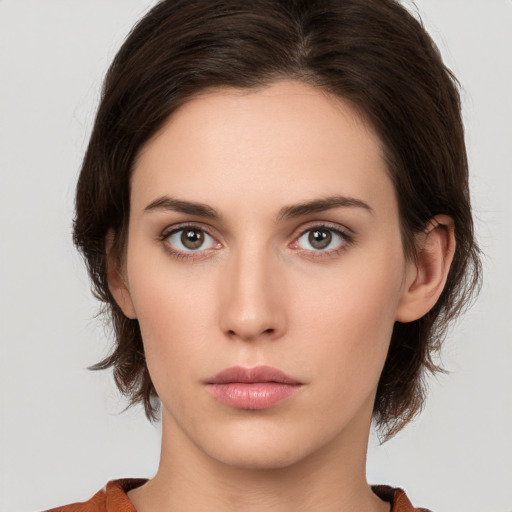 Neutral white young-adult female with medium  brown hair and brown eyes