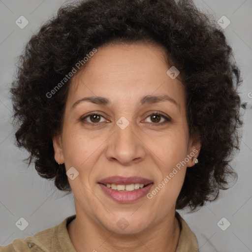 Joyful black adult female with medium  brown hair and brown eyes