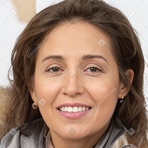 Joyful white adult female with long  brown hair and brown eyes