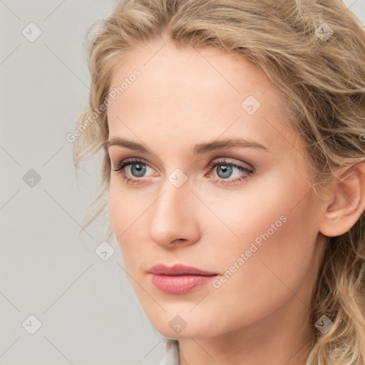 Neutral white young-adult female with long  brown hair and blue eyes