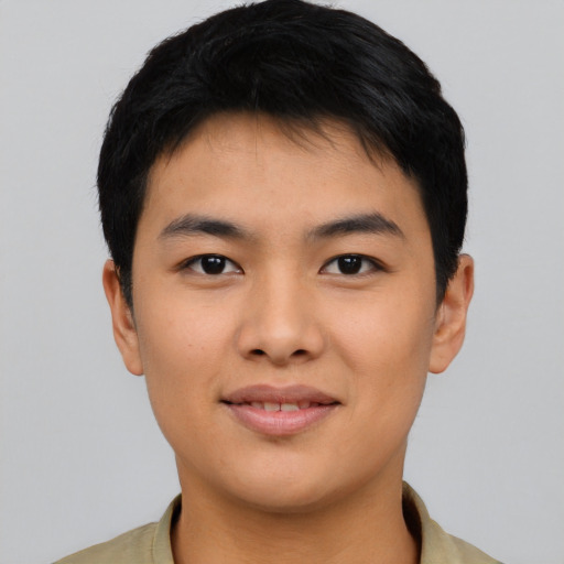 Joyful asian young-adult male with short  black hair and brown eyes