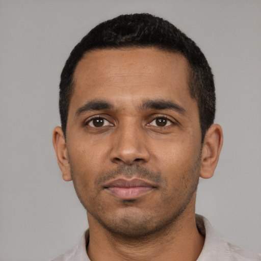 Neutral black young-adult male with short  black hair and brown eyes