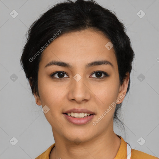 Joyful latino young-adult female with medium  brown hair and brown eyes