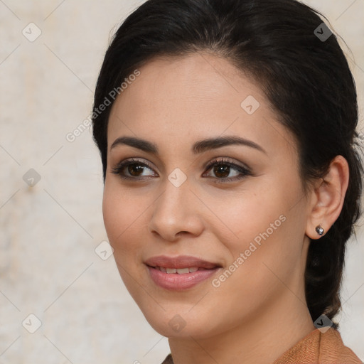 Joyful latino young-adult female with medium  brown hair and brown eyes