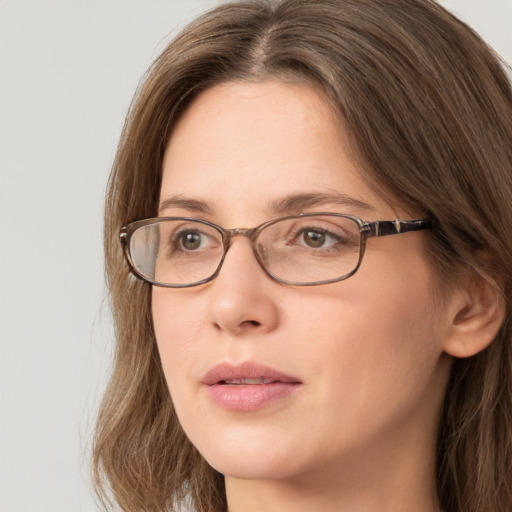 Neutral white young-adult female with long  brown hair and grey eyes