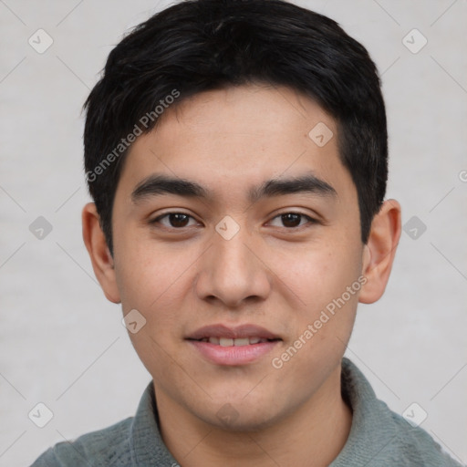 Joyful asian young-adult male with short  black hair and brown eyes