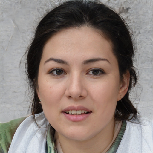 Joyful white young-adult female with medium  brown hair and brown eyes