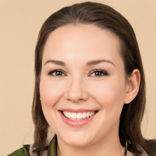 Joyful white young-adult female with medium  brown hair and brown eyes