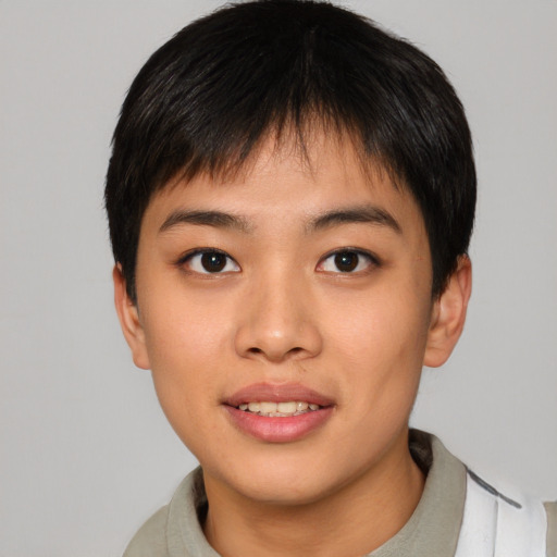Joyful asian young-adult male with short  brown hair and brown eyes