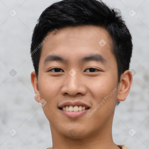 Joyful asian young-adult male with short  black hair and brown eyes