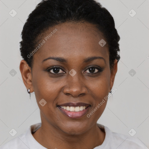 Joyful black young-adult female with short  brown hair and brown eyes