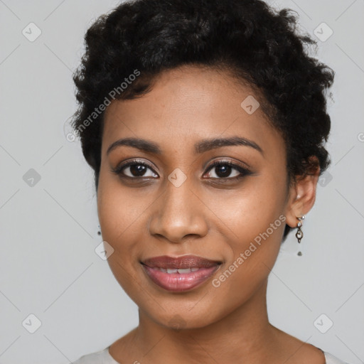 Joyful black young-adult female with short  black hair and brown eyes