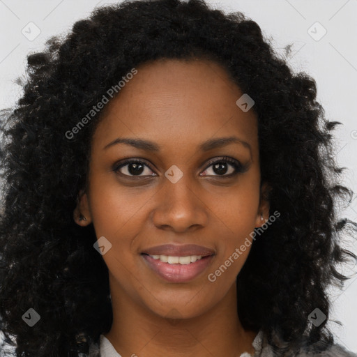 Joyful black young-adult female with long  brown hair and brown eyes