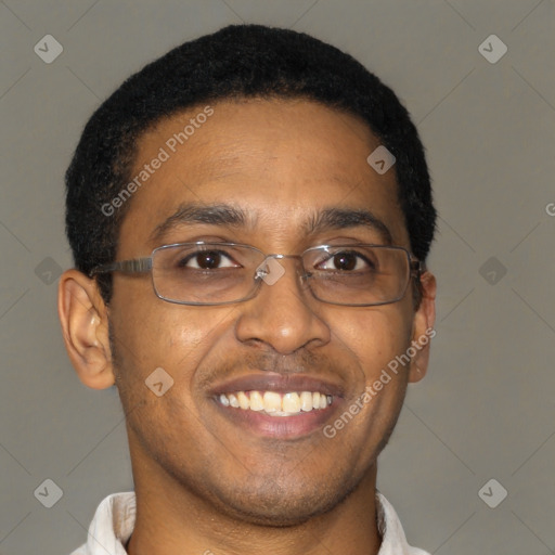 Joyful black young-adult male with short  brown hair and brown eyes