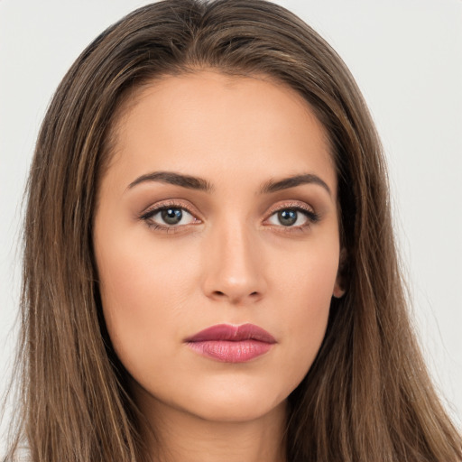 Neutral white young-adult female with long  brown hair and brown eyes