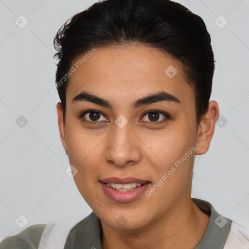 Joyful latino young-adult female with short  brown hair and brown eyes