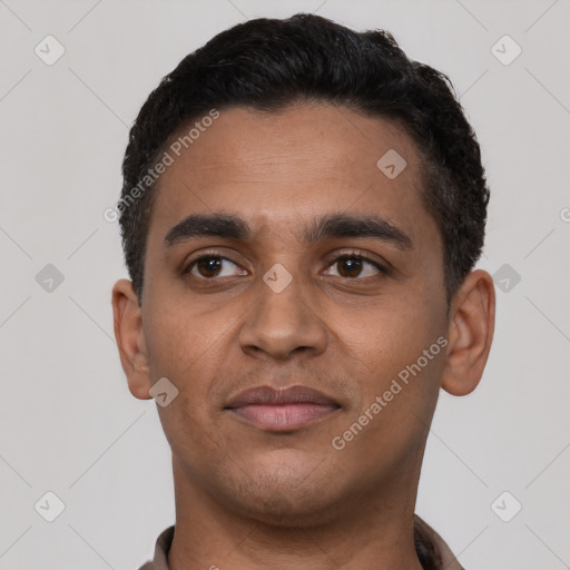 Joyful latino young-adult male with short  black hair and brown eyes