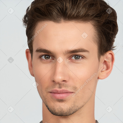 Neutral white young-adult male with short  brown hair and brown eyes