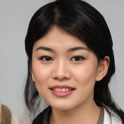 Joyful asian young-adult female with medium  black hair and brown eyes