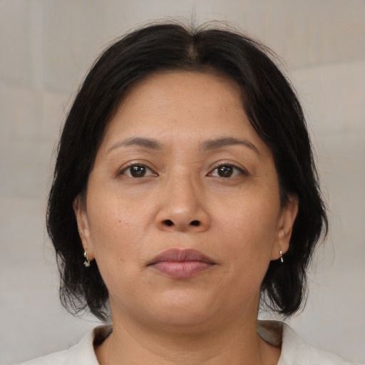 Neutral asian young-adult female with medium  brown hair and brown eyes