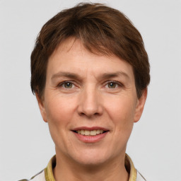 Joyful white adult female with short  brown hair and grey eyes