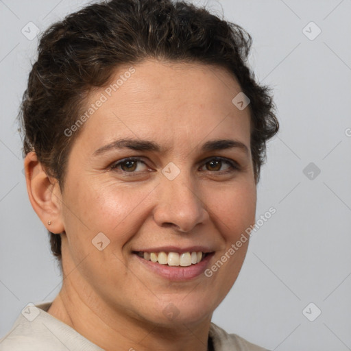 Joyful white adult female with short  brown hair and brown eyes