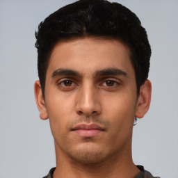 Neutral white young-adult male with short  black hair and brown eyes