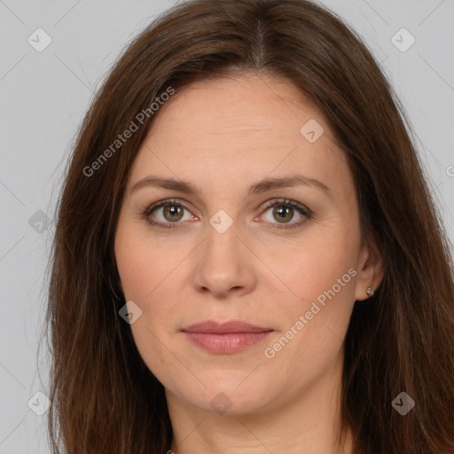 Joyful white adult female with long  brown hair and brown eyes