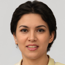 Joyful white young-adult female with medium  brown hair and brown eyes