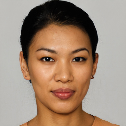 Joyful latino young-adult female with short  black hair and brown eyes