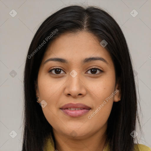 Joyful latino young-adult female with long  brown hair and brown eyes